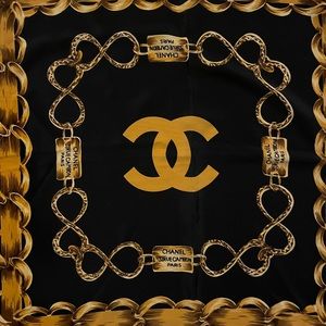 Black chanel scarf with chain design. Cannot verify that it is authentic